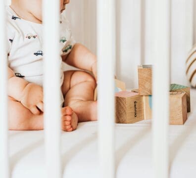 a baby and a baby gate